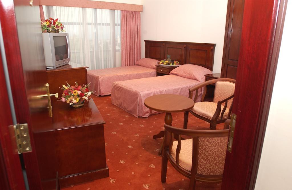 City Center Hotel Manama Quarto foto